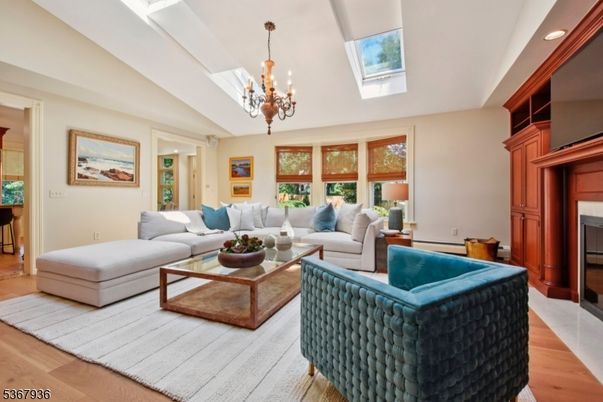 Chandelier, Fireplace, Interior, Living room, Recessed Lighting, Wood Texture Flooring