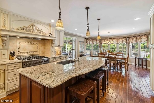 Dining room, Interior, Kitchen, Pendant Lights, Recessed Lighting, Stainless Steel Appliances, Wood Texture Flooring