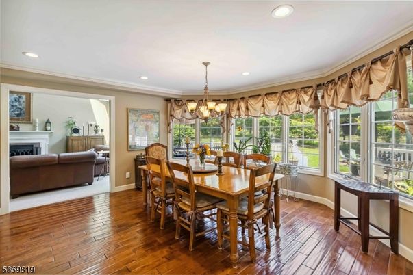 Chandelier, Dining room, Fireplace, Interior, Living room, Recessed Lighting, Wood Texture Flooring