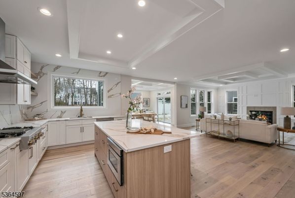 Fireplace, Interior, Kitchen, Living room, Recessed Lighting, Stainless Steel Appliances, Wood Texture Flooring