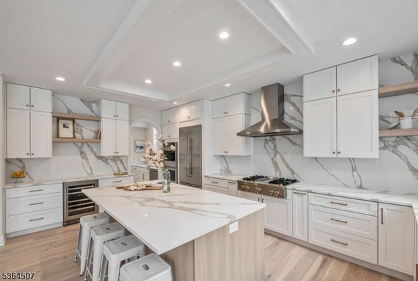 Interior, Kitchen, Marble Walls, Recessed Lighting, Stainless Steel Appliances, Wood Texture Flooring
