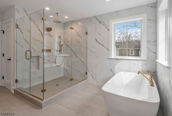 Bathroom, Free Standing Baths, Glass Shower, Interior, Marble Walls, Recessed Lighting