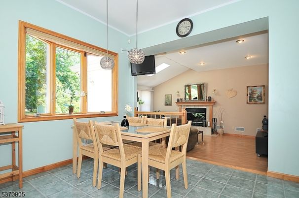 Dining room, Fireplace, Interior, Pendant Lights, Recessed Lighting, Wood Texture Flooring