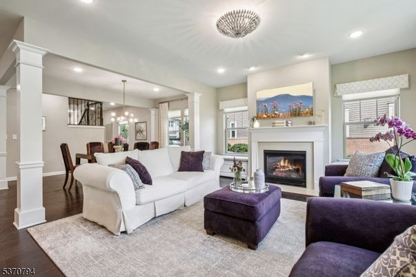 Dining room, Fireplace, Interior, Living room, Pendant Lights, Recessed Lighting, Wood Texture Flooring