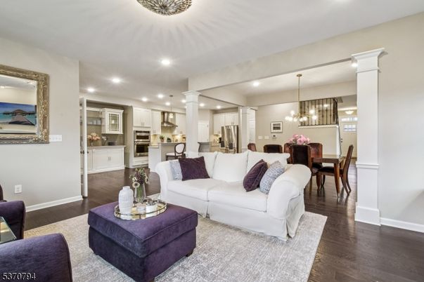 Chandelier, Dining room, Interior, Kitchen, Living room, Pendant Lights, Recessed Lighting, Stainless Steel Appliances, Wood Texture Flooring