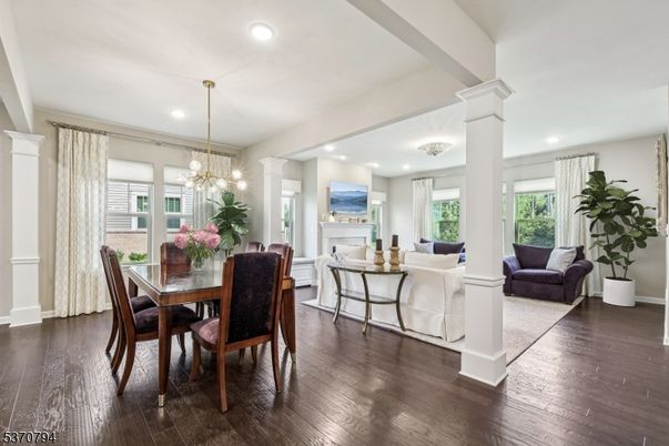 Chandelier, Dining room, Fireplace, Interior, Living room, Pendant Lights, Recessed Lighting, Wood Texture Flooring