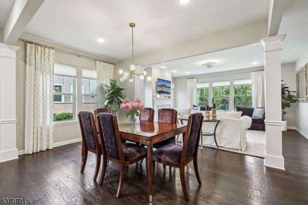 Dining room, Fireplace, Interior, Living room, Pendant Lights, Recessed Lighting, Wood Texture Flooring