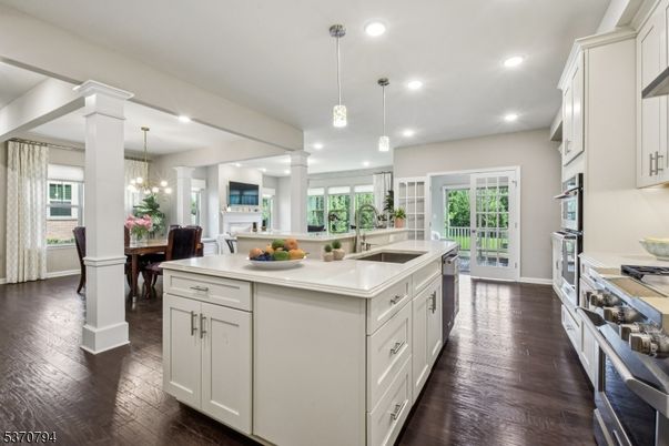 Chandelier, Dining room, Interior, Kitchen, Pendant Lights, Recessed Lighting, Stainless Steel Appliances, Wood Texture Flooring