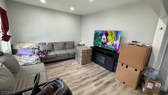 Fireplace, Interior, Living room, Recessed Lighting, Wood Texture Flooring