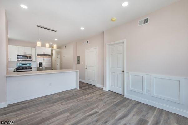 Interior, Kitchen, Pendant Lights, Recessed Lighting, Stainless Steel Appliances, Wood Texture Flooring
