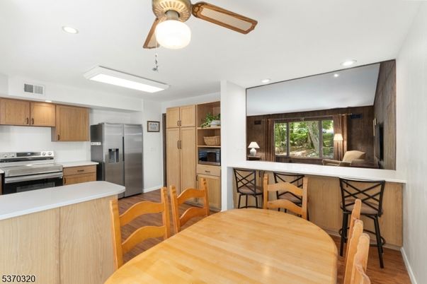 Dining room, Interior, Kitchen, Recessed Lighting, Stainless Steel Appliances, Wood Texture Flooring