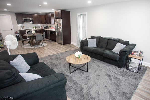 Dining room, Interior, Kitchen, Living room, Recessed Lighting, Stainless Steel Appliances, Wood Texture Flooring