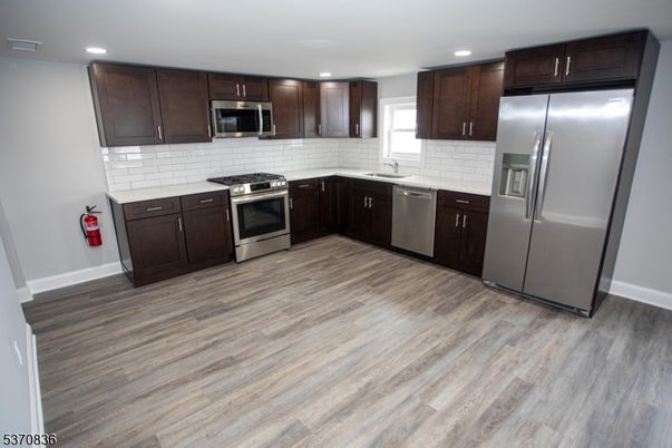 Interior, Kitchen, Recessed Lighting, Stainless Steel Appliances, Wood Texture Flooring