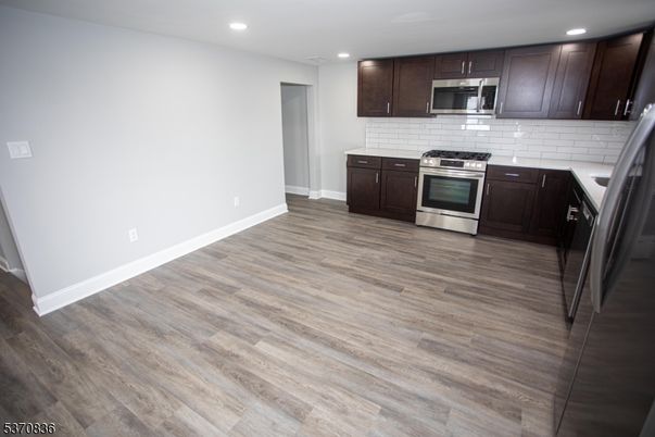 Interior, Kitchen, Recessed Lighting, Stainless Steel Appliances, Wood Texture Flooring