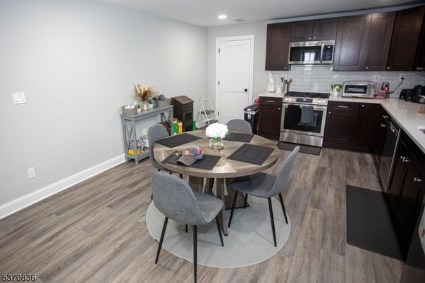 Dining room, Interior, Kitchen, Recessed Lighting, Stainless Steel Appliances, Wood Texture Flooring