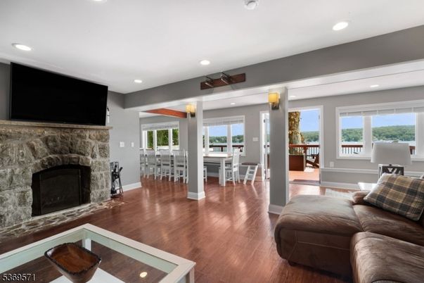 Dining room, Fireplace, Interior, Living room, Recessed Lighting, Wood Texture Flooring