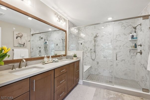 Bathroom, Dual Sink Vanities, Glass Shower, Interior, Marble Walls, Recessed Lighting