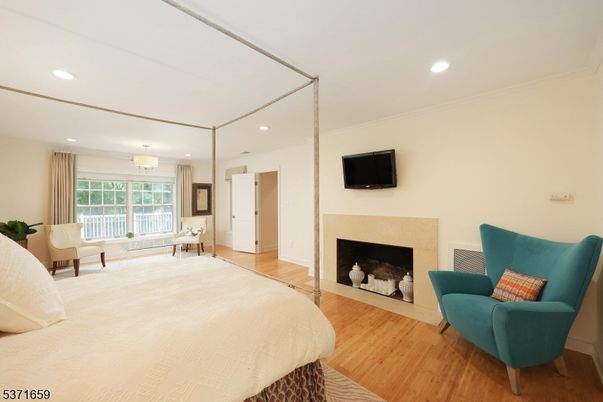 Bedroom, Fireplace, Interior, Recessed Lighting, Wood Texture Flooring