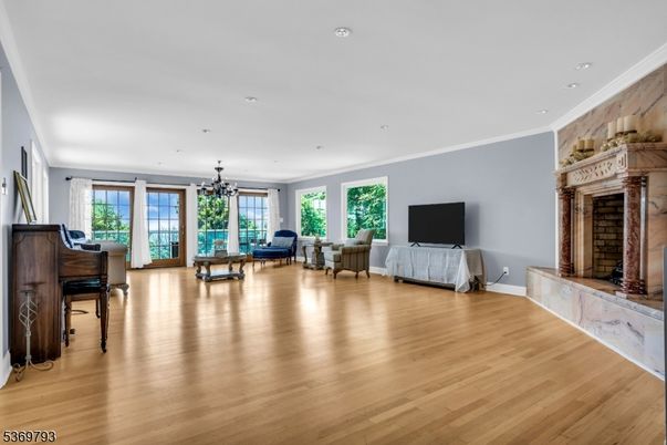 Fireplace, Interior, Living room, Piano, Recessed Lighting, Wood Texture Flooring