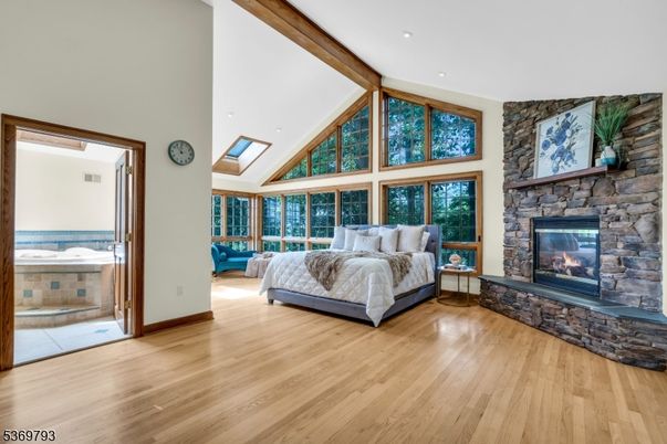 Bedroom, Fireplace, Interior, Recessed Lighting, Stone Walls, Wood Texture Flooring