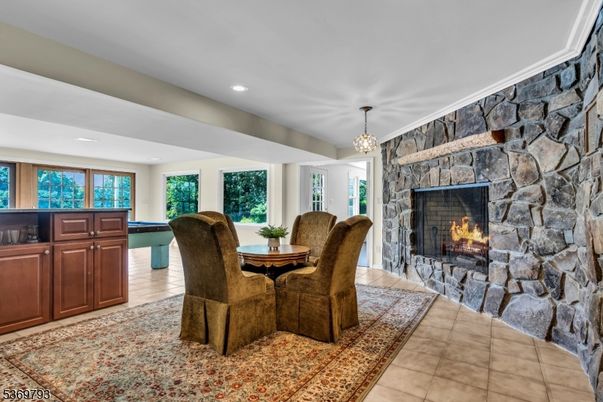 Chandelier, Dining room, Fireplace, Interior, Pendant Lights, Recessed Lighting, Stone Walls