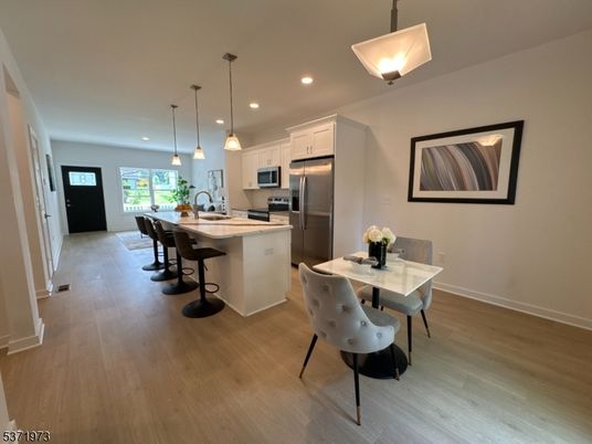 Dining room, Interior, Kitchen, Pendant Lights, Recessed Lighting, Stainless Steel Appliances, Wood Texture Flooring
