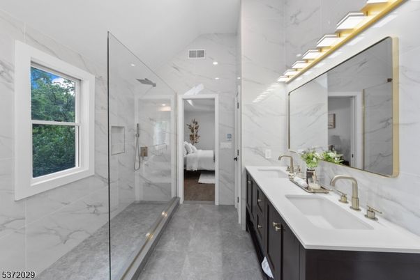 Bathroom, Dual Sink Vanities, Glass Shower, Interior, Marble Walls, Recessed Lighting