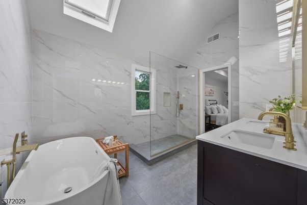 Bathroom, Dual Sink Vanities, Glass Shower, Interior, Marble Walls, Recessed Lighting