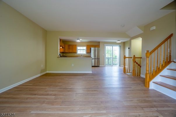 Empty room, Interior, Kitchen, Stainless Steel Appliances, Wood Texture Flooring