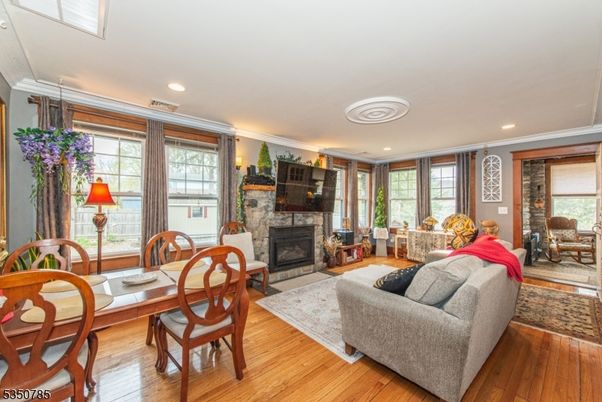 Dining room, Fireplace, Interior, Living room, Recessed Lighting, Wood Texture Flooring
