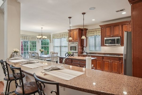 Chandelier, Dining room, Interior, Kitchen, Pendant Lights, Recessed Lighting, Stainless Steel Appliances