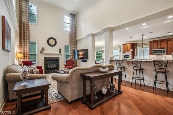 Fireplace, Interior, Kitchen, Living room, Pendant Lights, Recessed Lighting, Stainless Steel Appliances, Wood Texture Flooring