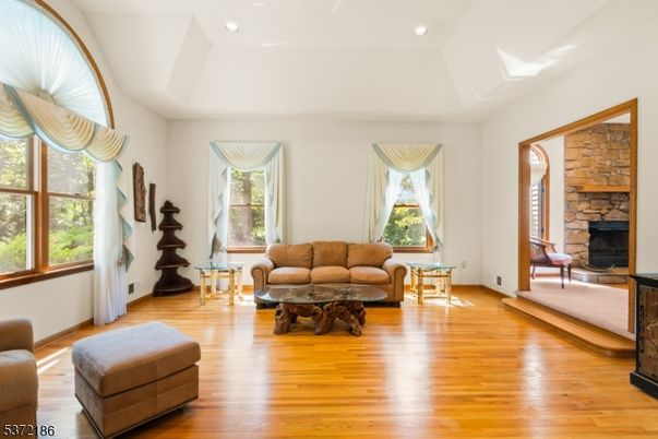 Fireplace, Interior, Living room, Recessed Lighting, Stone Walls, Wood Texture Flooring