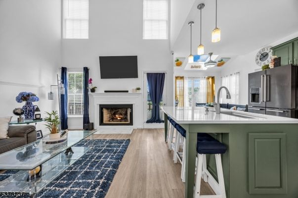 Fireplace, Interior, Kitchen, Pendant Lights, Stainless Steel Appliances, Wood Texture Flooring