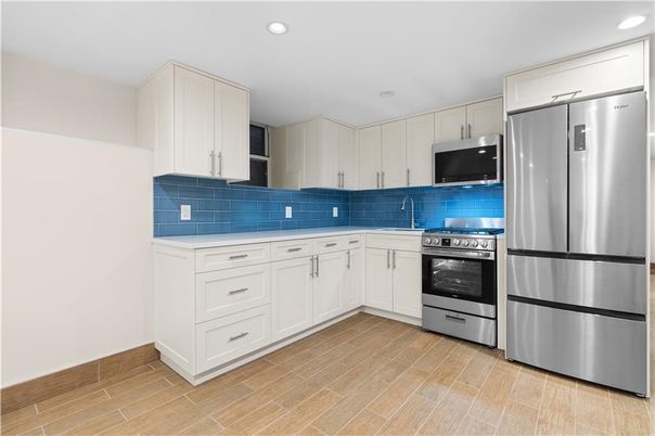 Interior, Kitchen, Recessed Lighting, Stainless Steel Appliances, Wood Texture Flooring