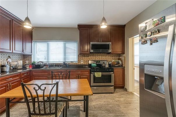 Dining room, Interior, Kitchen, Pendant Lights, Stainless Steel Appliances, Wood Texture Flooring