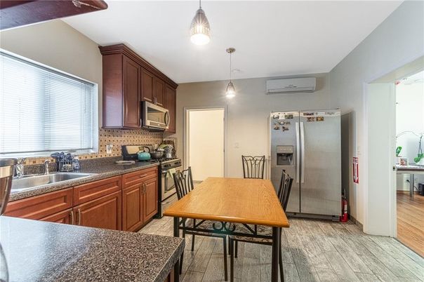 Dining room, Interior, Kitchen, Pendant Lights, Stainless Steel Appliances, Wood Texture Flooring