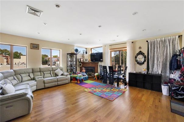 Dining room, Fireplace, Interior, Living room, Recessed Lighting, Wood Texture Flooring