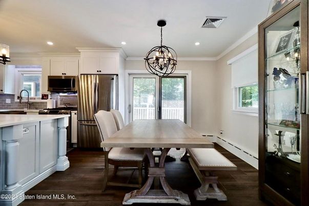 Chandelier, Dining room, Interior, Kitchen, Pendant Lights, Recessed Lighting, Stainless Steel Appliances, Wood Texture Flooring