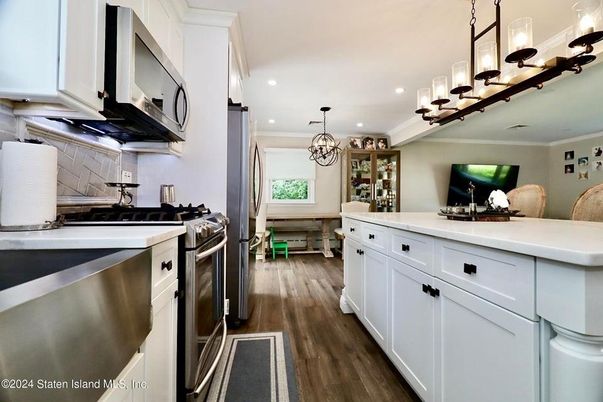 Chandelier, Interior, Kitchen, Recessed Lighting, Stainless Steel Appliances, Wood Texture Flooring