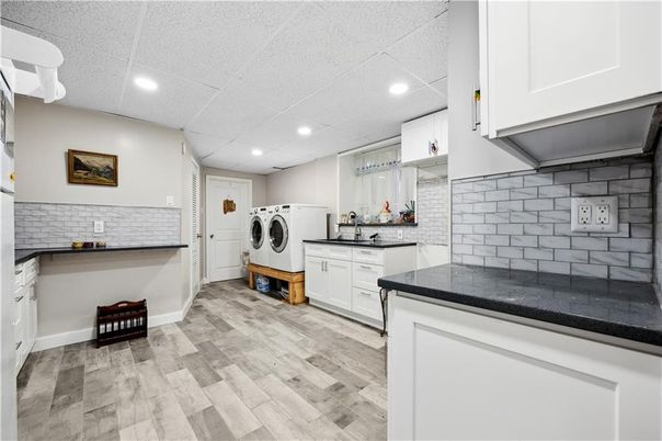 Interior, Kitchen, Recessed Lighting, Washer, Wood Texture Flooring