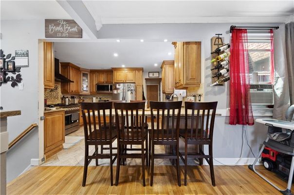 Dining room, Interior, Kitchen, Recessed Lighting, Stainless Steel Appliances, Wood Texture Flooring