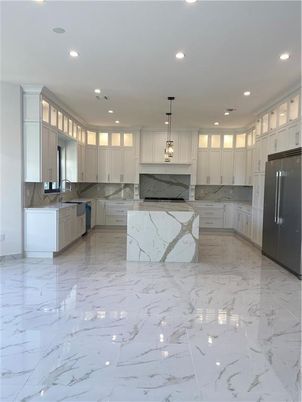 Interior, Kitchen, Marble, Marble Walls, Pendant Lights, Recessed Lighting, Stainless Steel Appliances