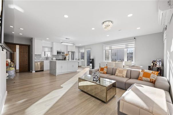Chandelier, Dining room, Interior, Kitchen, Living room, Pendant Lights, Recessed Lighting, Stainless Steel Appliances, Wood Texture Flooring