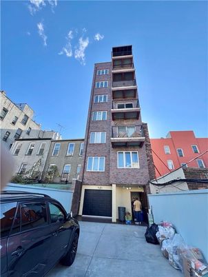 Attached, Exterior, Facade, Brick Facade, Condo Building