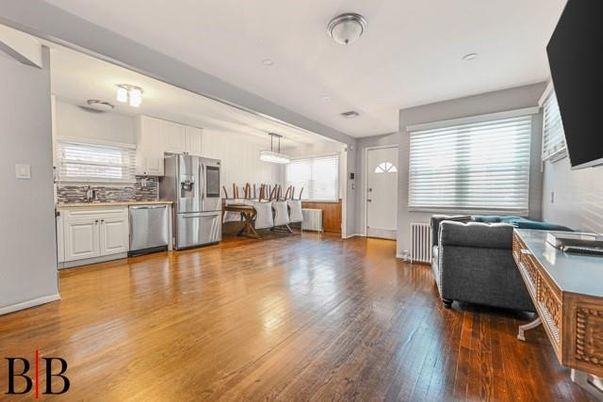 Dining room, Interior, Kitchen, Living room, Pendant Lights, Recessed Lighting, Stainless Steel Appliances, Wood Texture Flooring