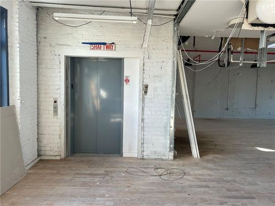 Elevator, Interior, Stone Walls, Wood Texture Flooring