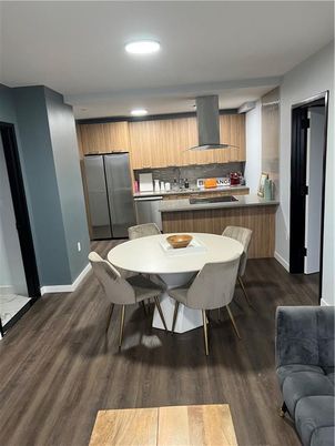 Dining room, Interior, Kitchen, Recessed Lighting, Stainless Steel Appliances, Wood Texture Flooring