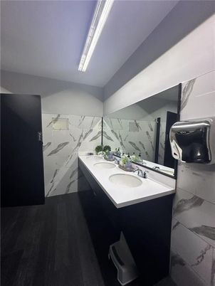 Bathroom, Dual Sink Vanities, Interior, Marble Walls, Wood Texture Flooring