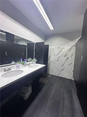 Bathroom, Dual Sink Vanities, Interior, Marble Walls, Wood Texture Flooring